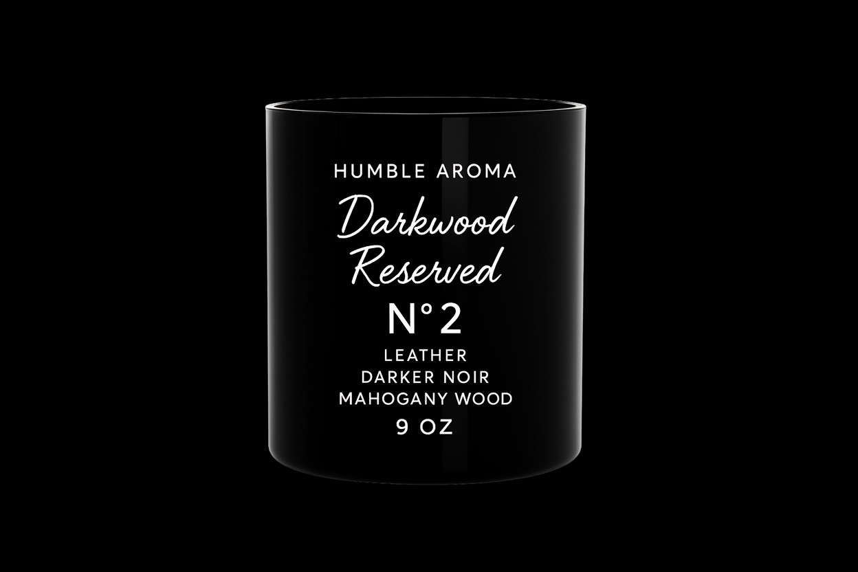 Black candle container with white text on a white background